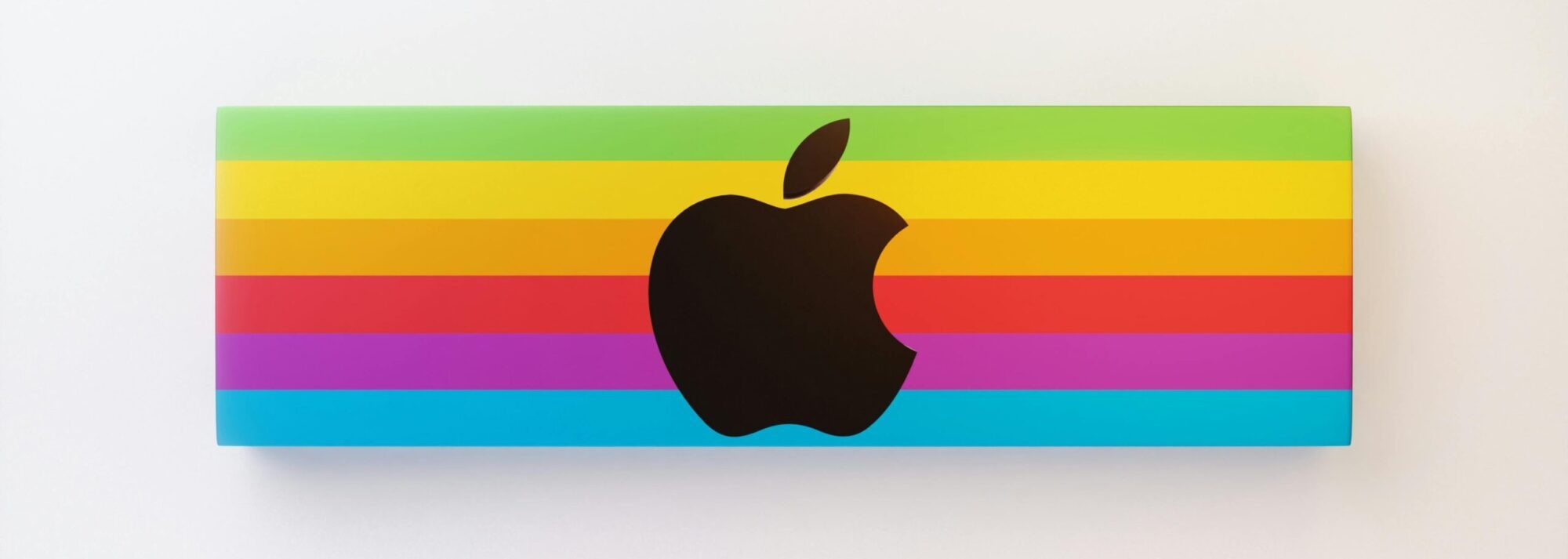 Apple logo on a rainbow background